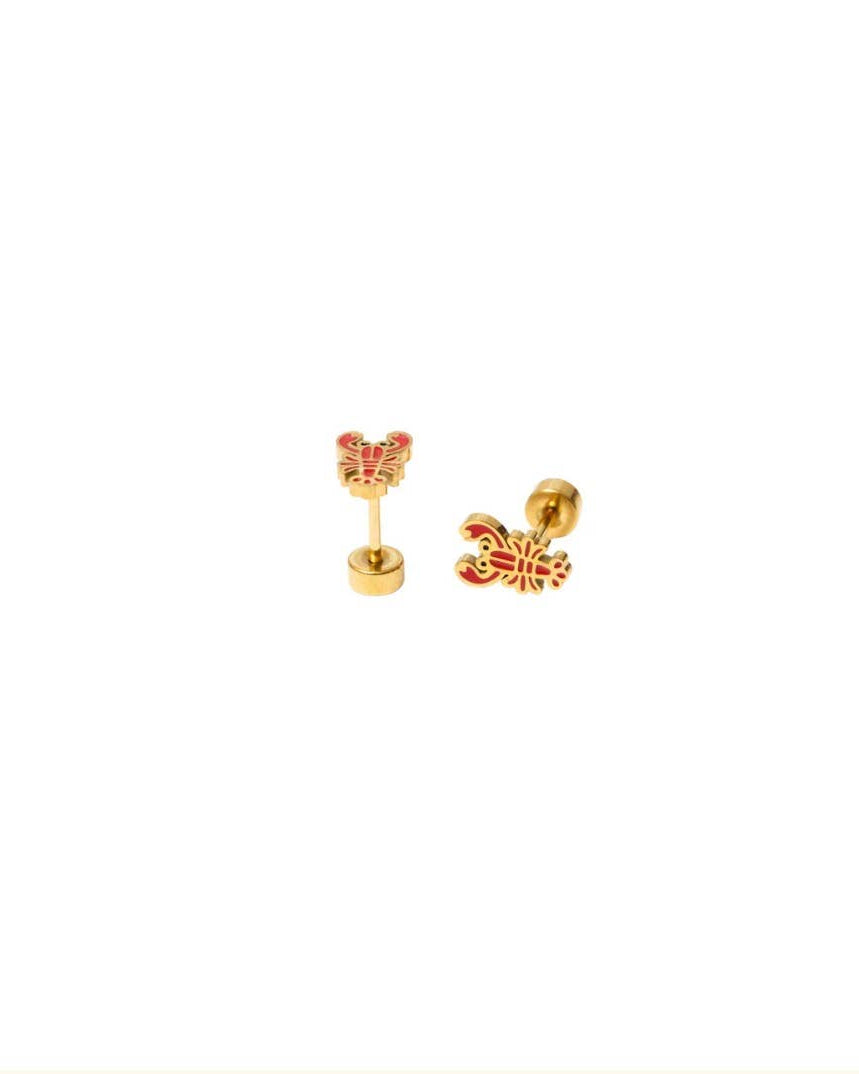 Silver heart-shaped earring with clear gemstones on a white background