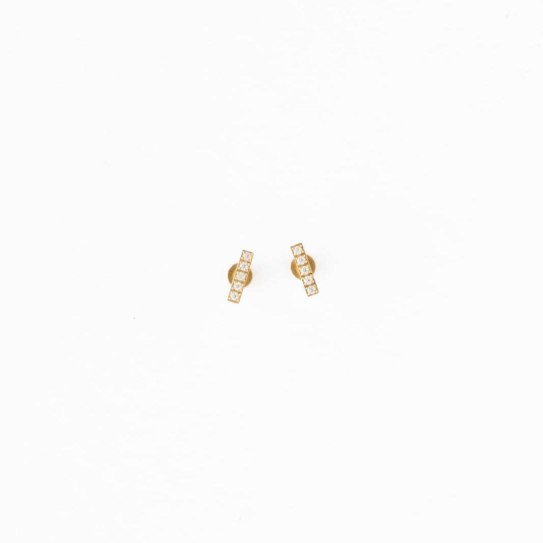 Gold earrings on a white background
