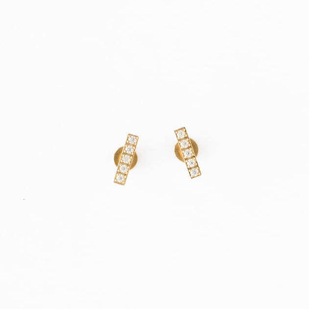 Gold earrings on a white background