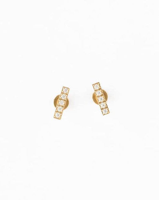 Gold earrings on a white background