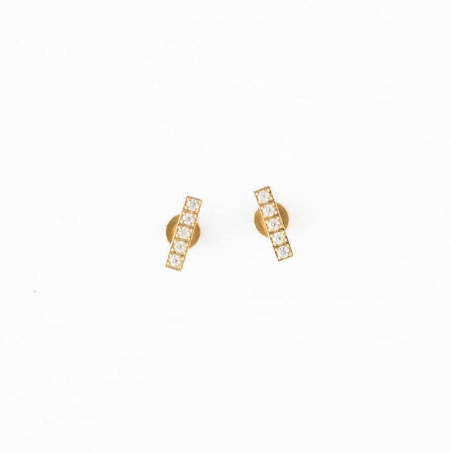 Gold earrings on a white background