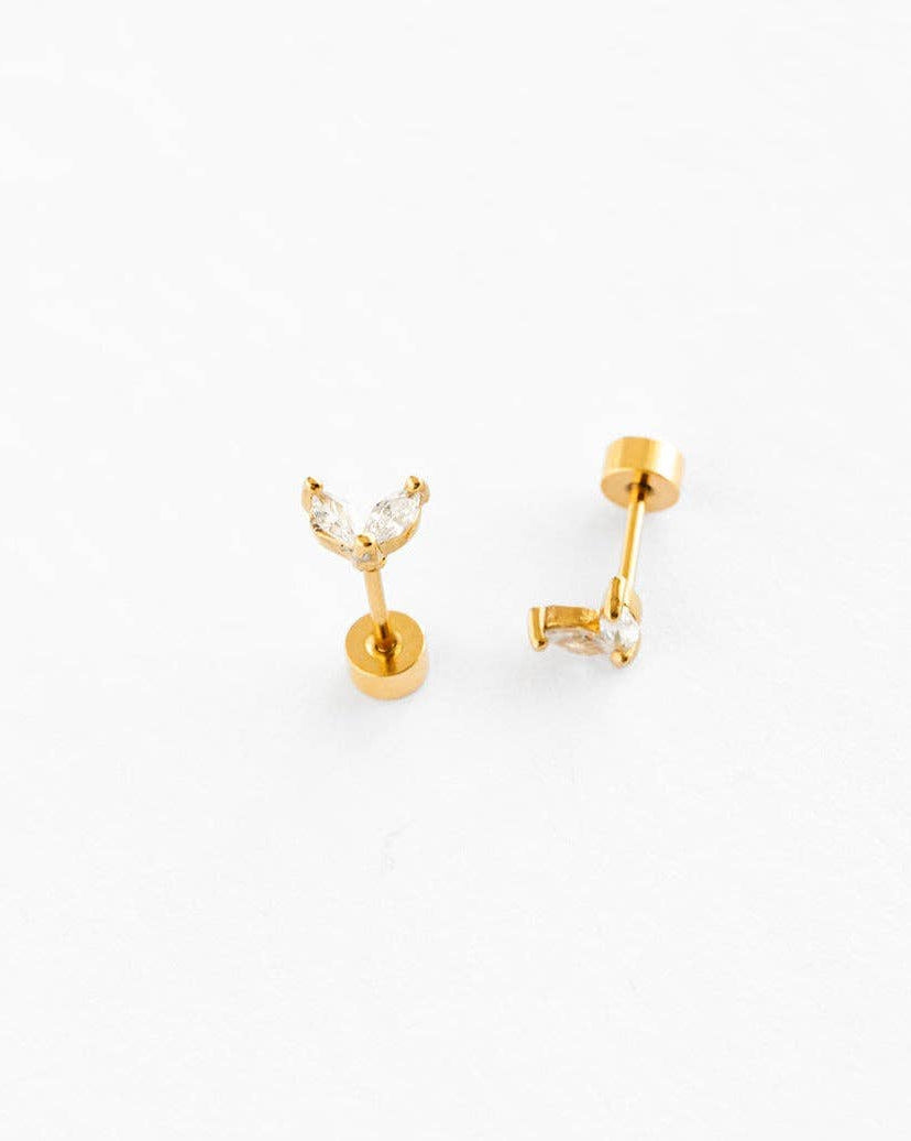 Gold earrings on a white background