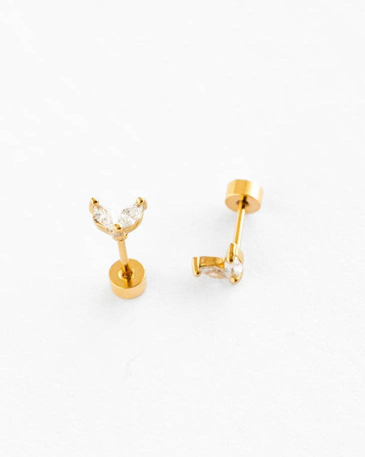 Gold earrings on a white background