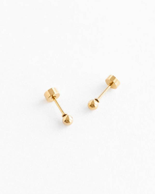 Pair of gold stud earrings on a white background