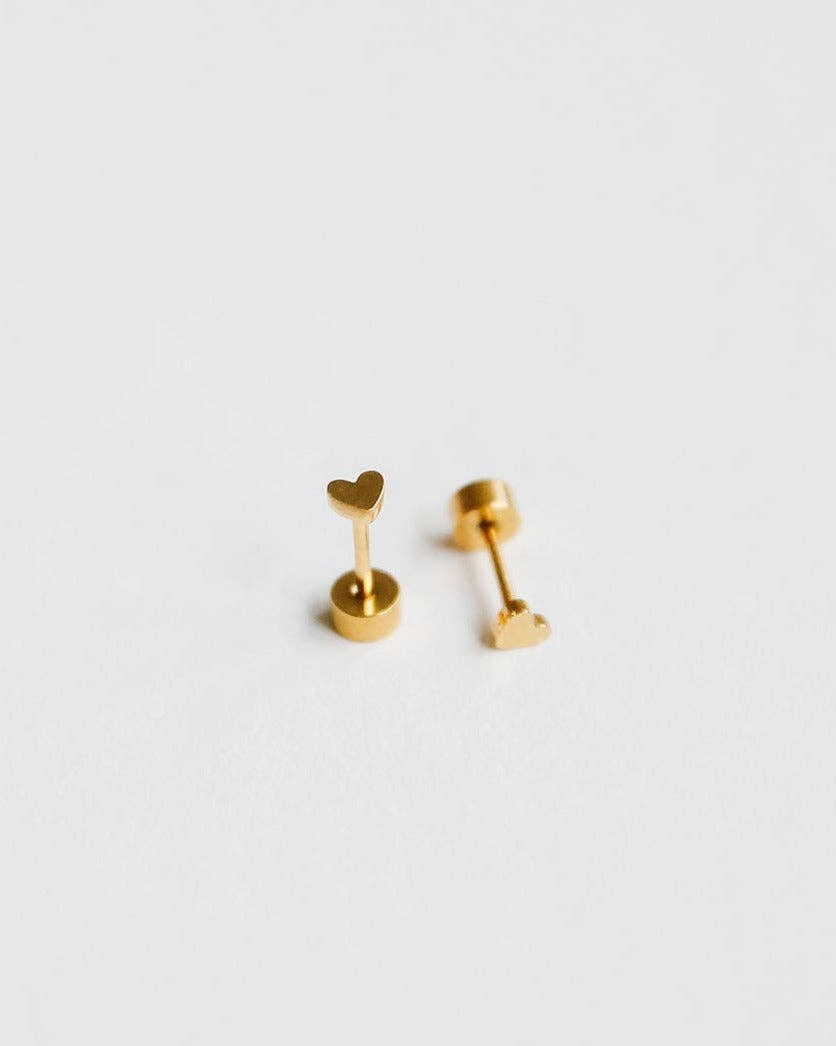 Pair of gold heart-shaped earrings on a light gray background
