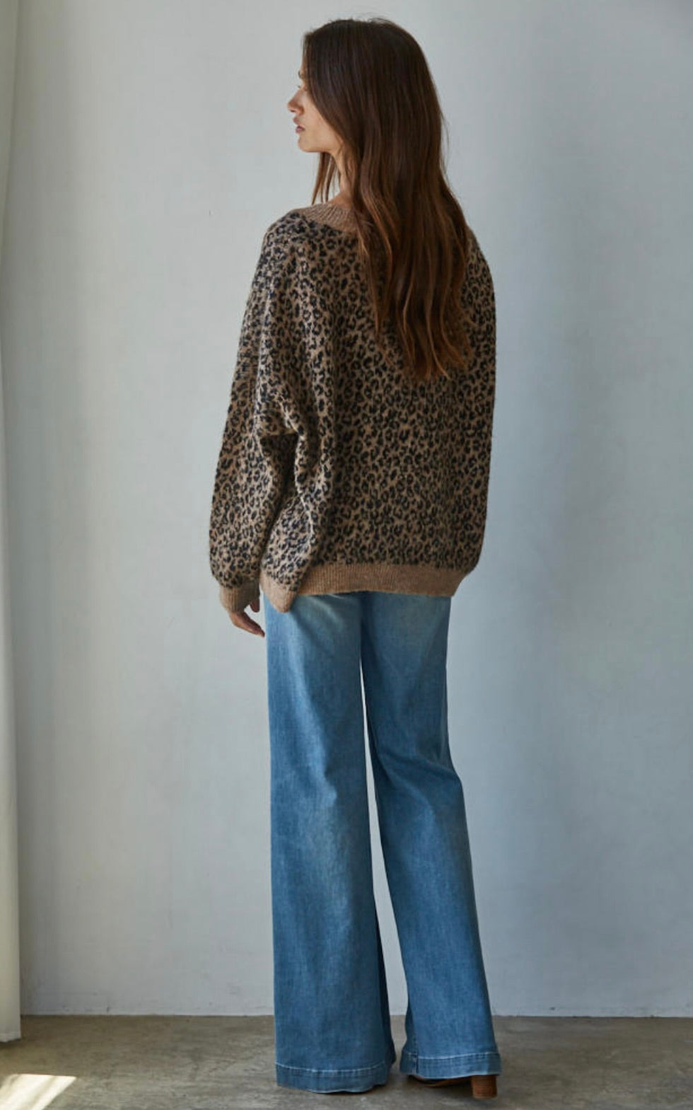 Person wearing a leopard print sweater