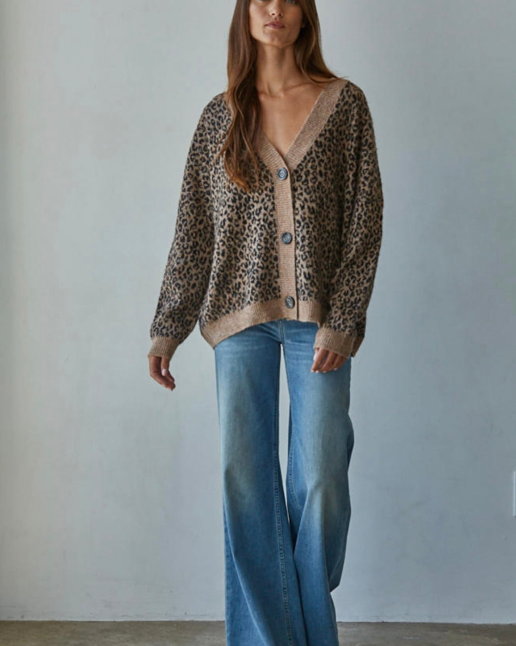 V-neck beauty features a bold animal print that instantly elevates any outfit.