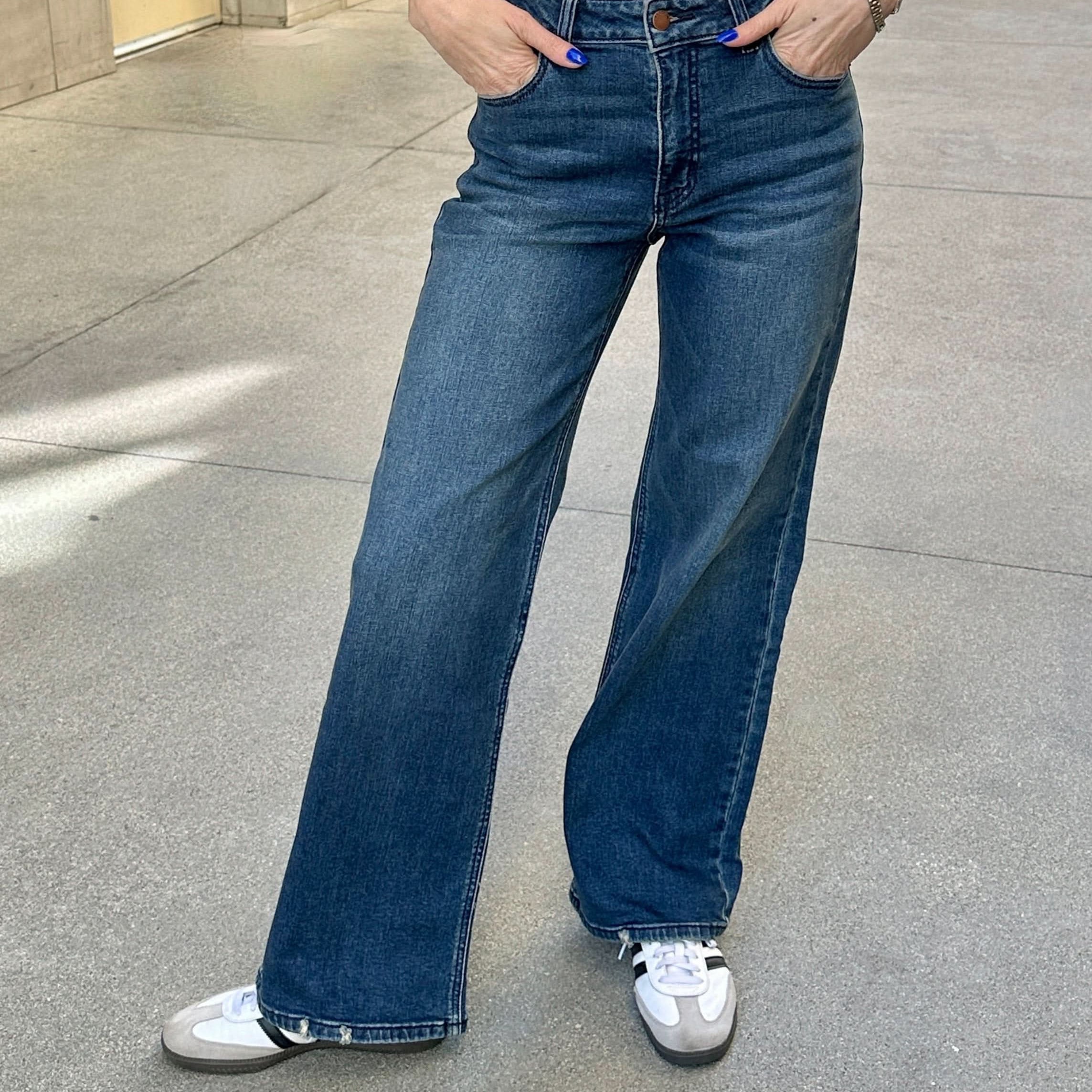 women wearing Wide Leg, Dark Wash Jeans perfect for any occasion.