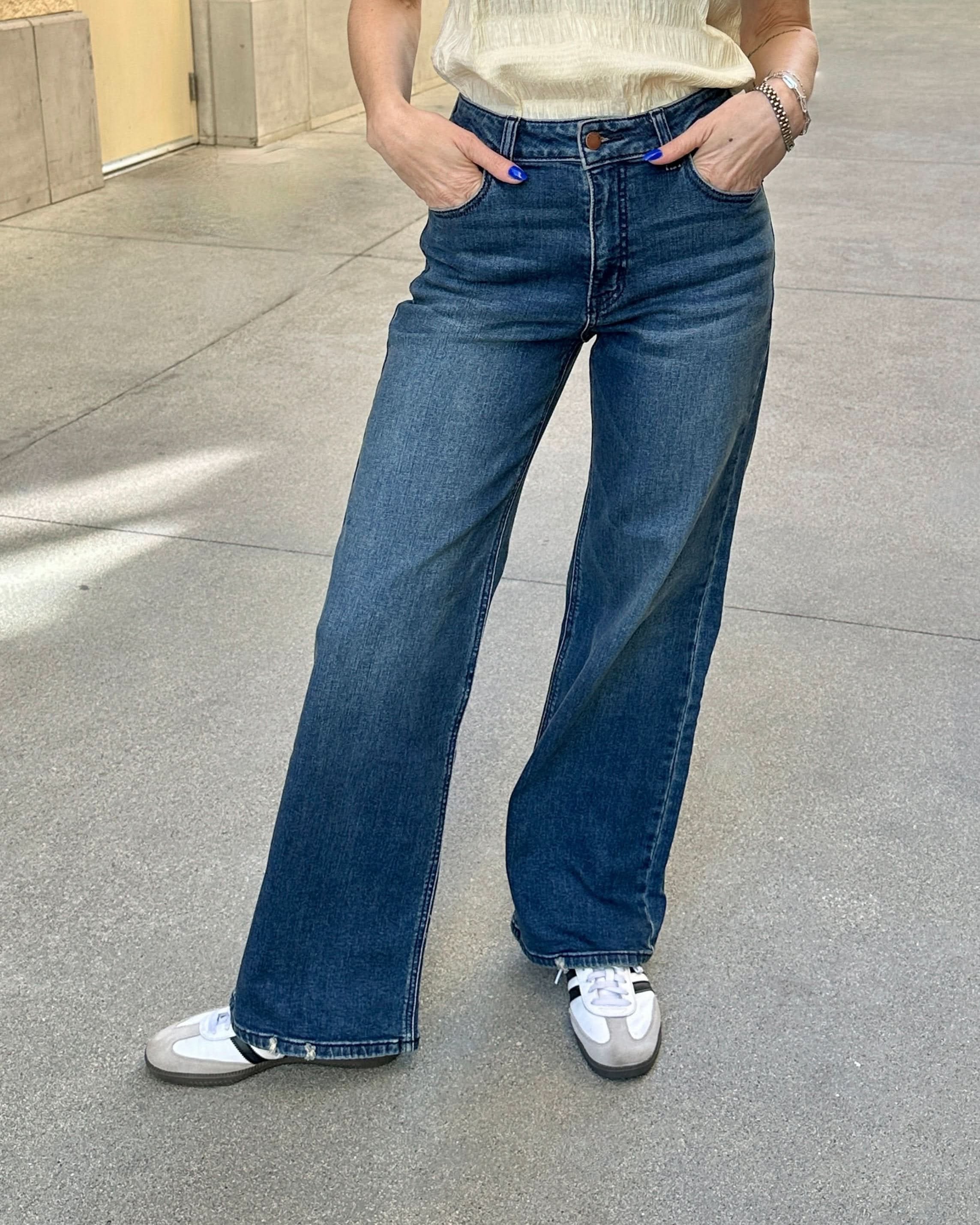 women wearing Wide Leg, Dark Wash Jeans perfect for any occasion.