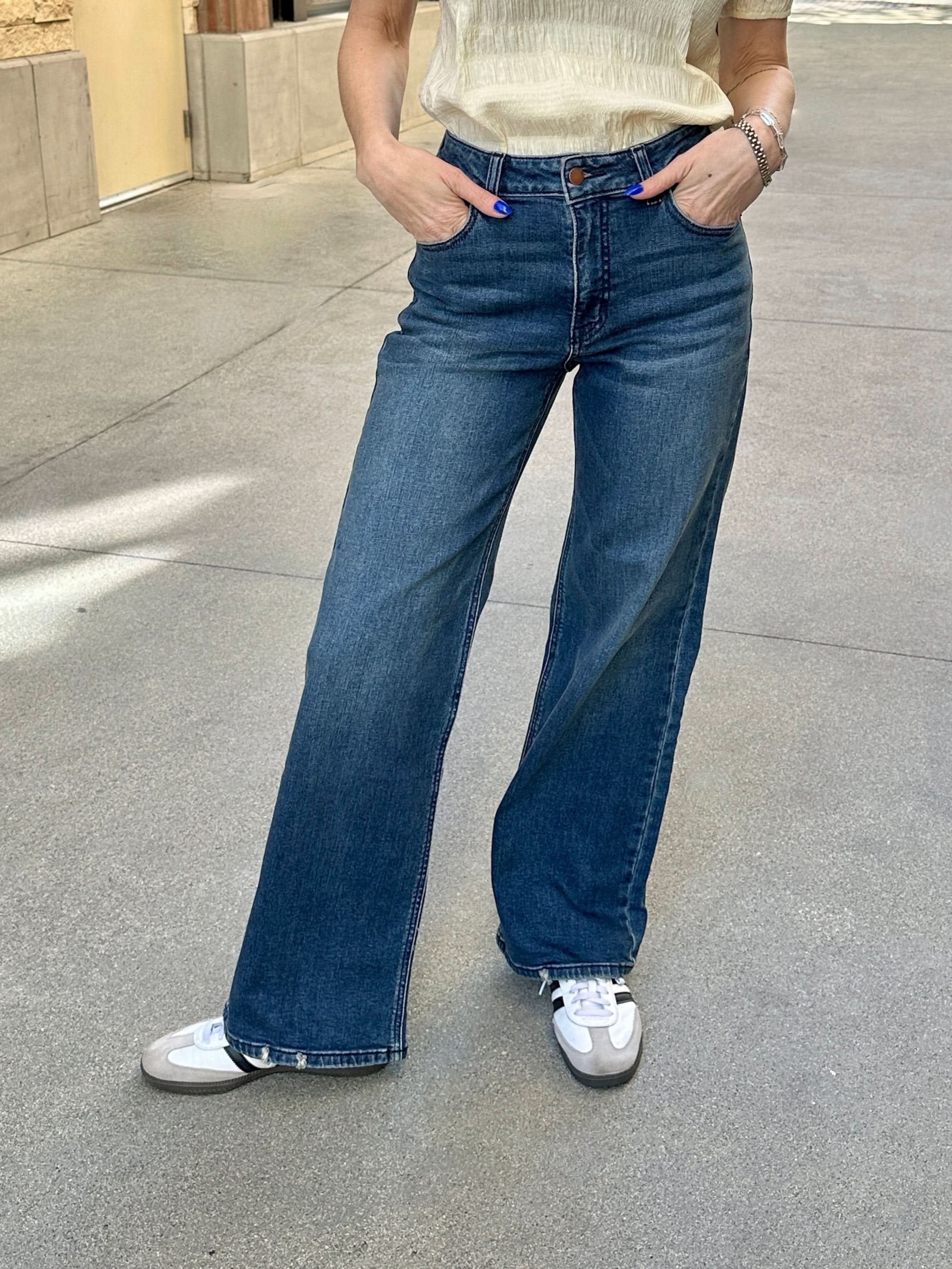 women wearing Wide Leg, Dark Wash Jeans on cement