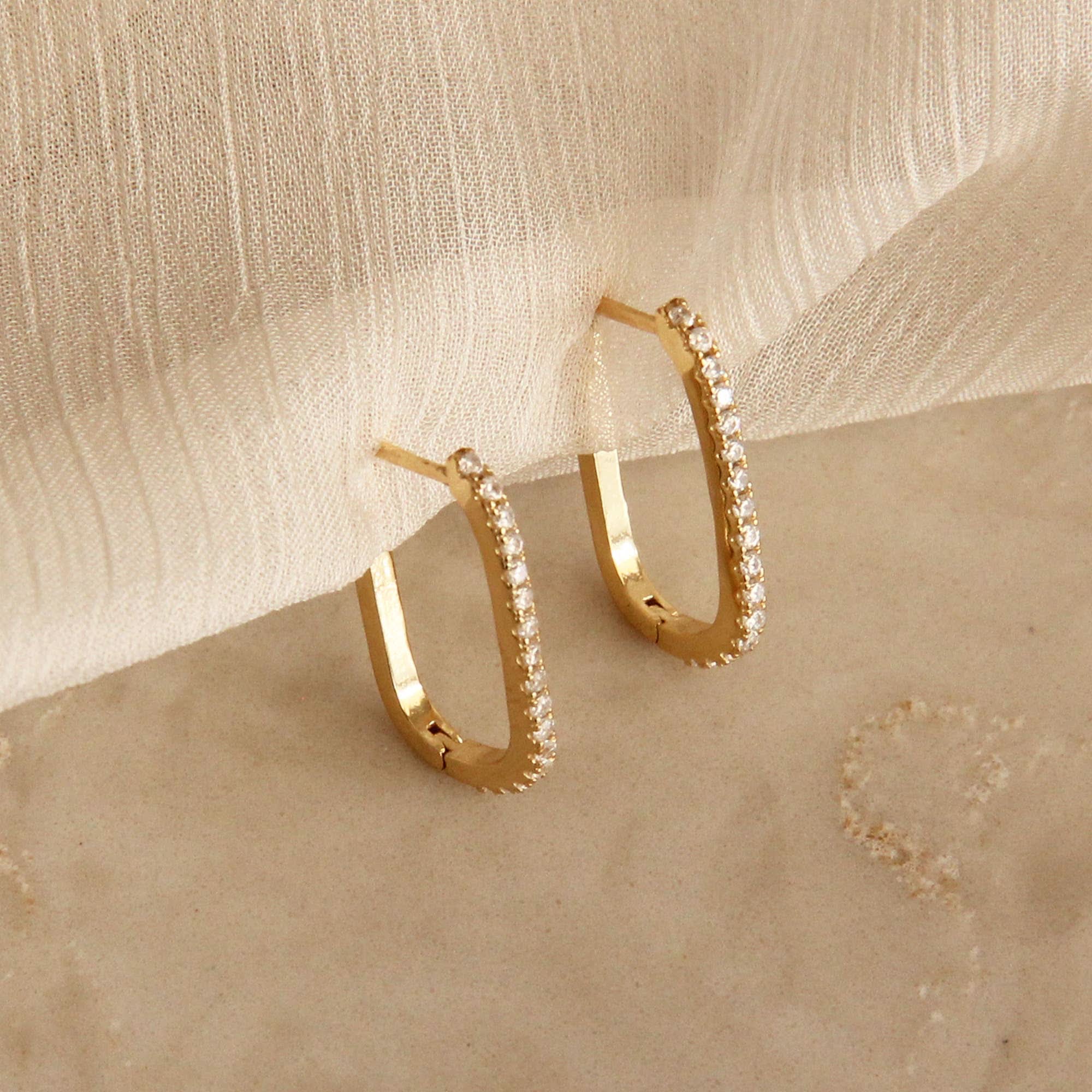 Gold hoop earrings lined with CZ detail pair box design