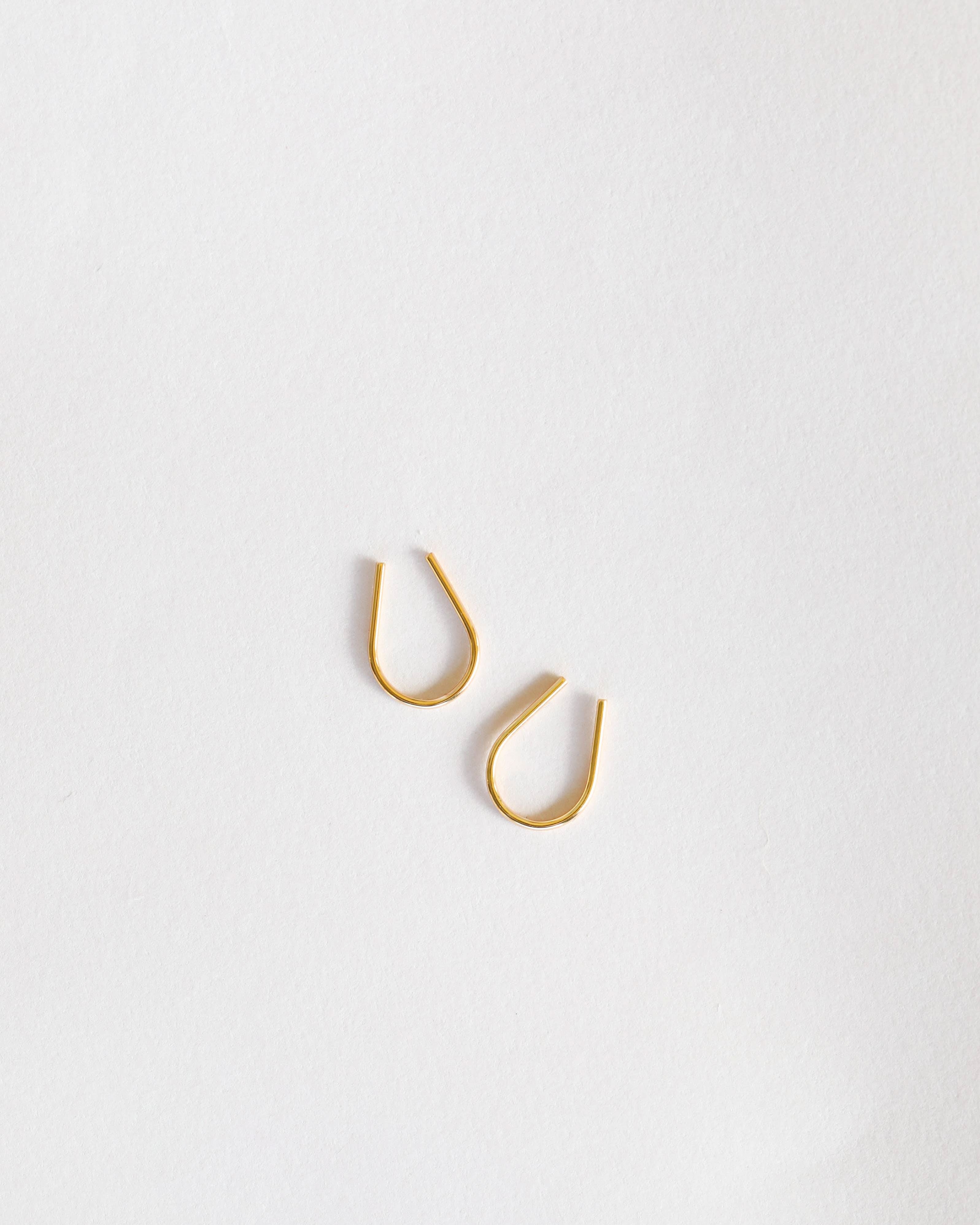 Minimalist Earrings Simple thin gold horseshoe earrings from Jax kelly