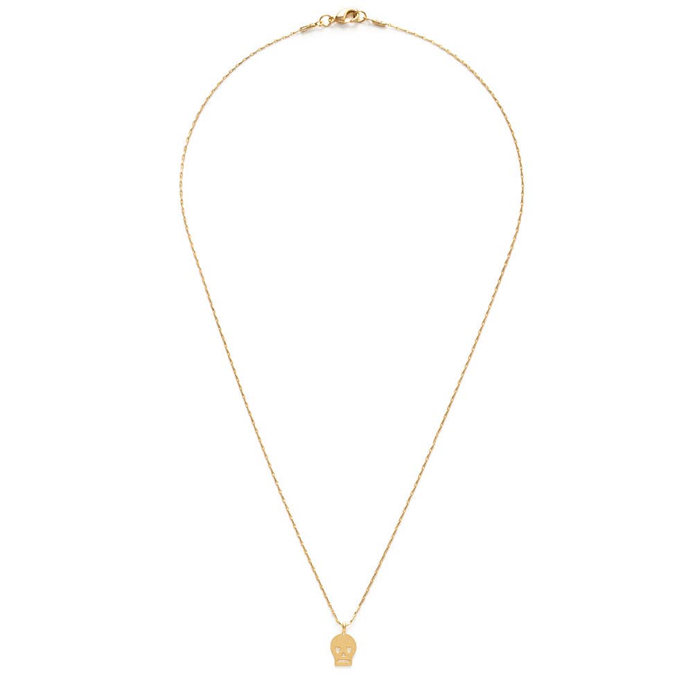 Gold necklace with a skull pendant on a white background