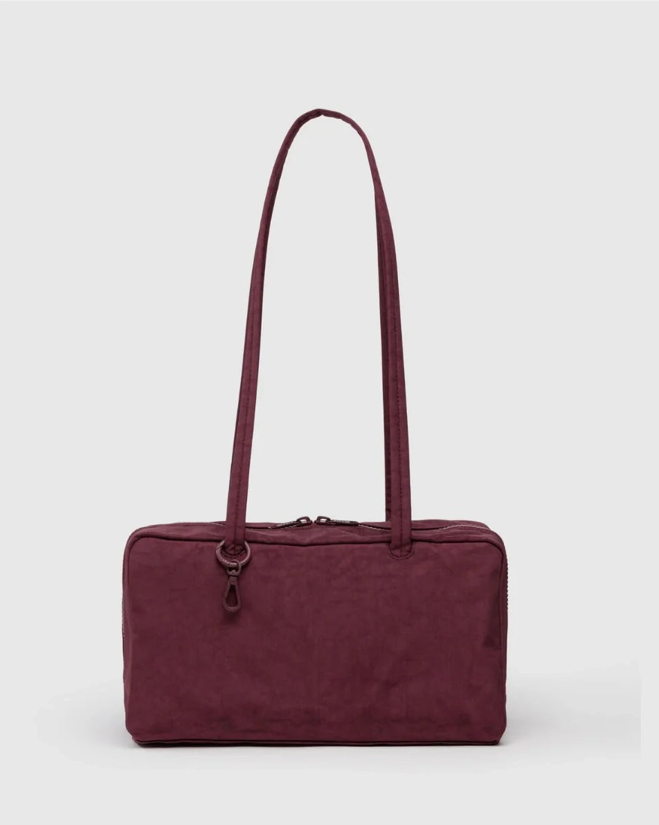 Maroon BAGGU bowler bag with a strap on a white background