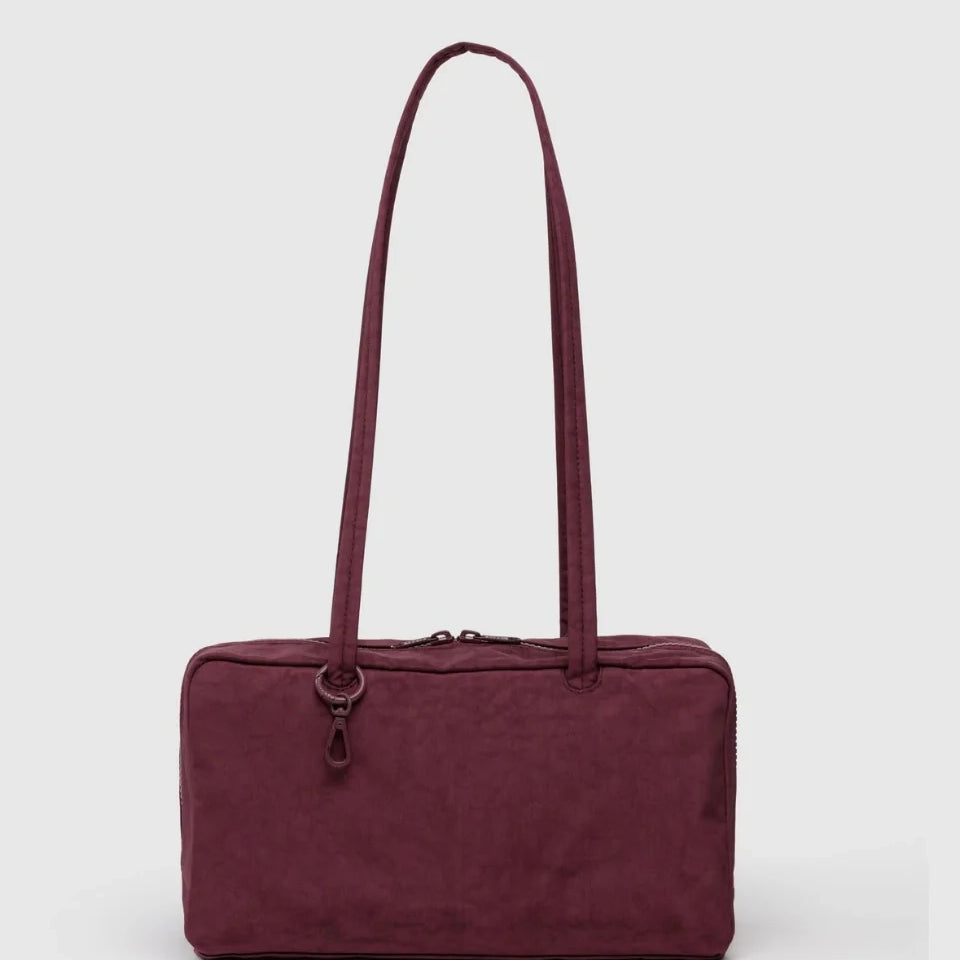 Maroon BAGGU bowler bag with a strap on a white background