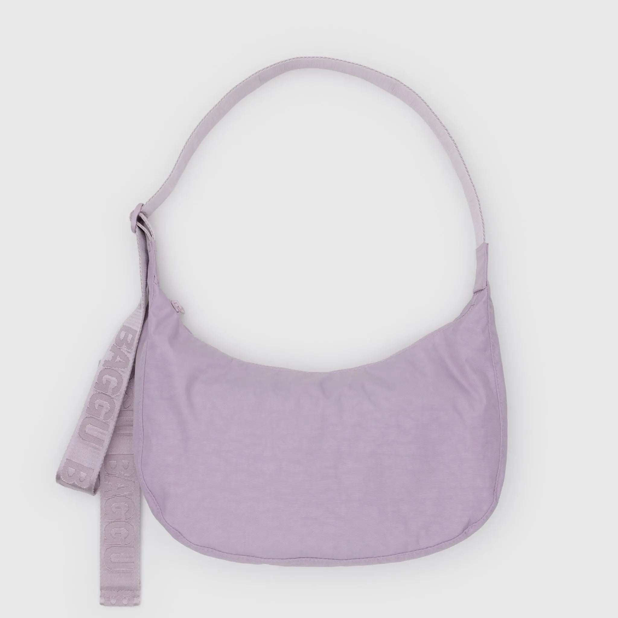 Purple handbag with a strap on a light purple Bag