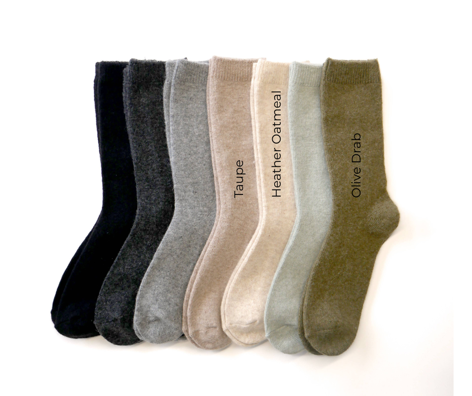 Set of six pairs of socks in different colors with labels on a white background