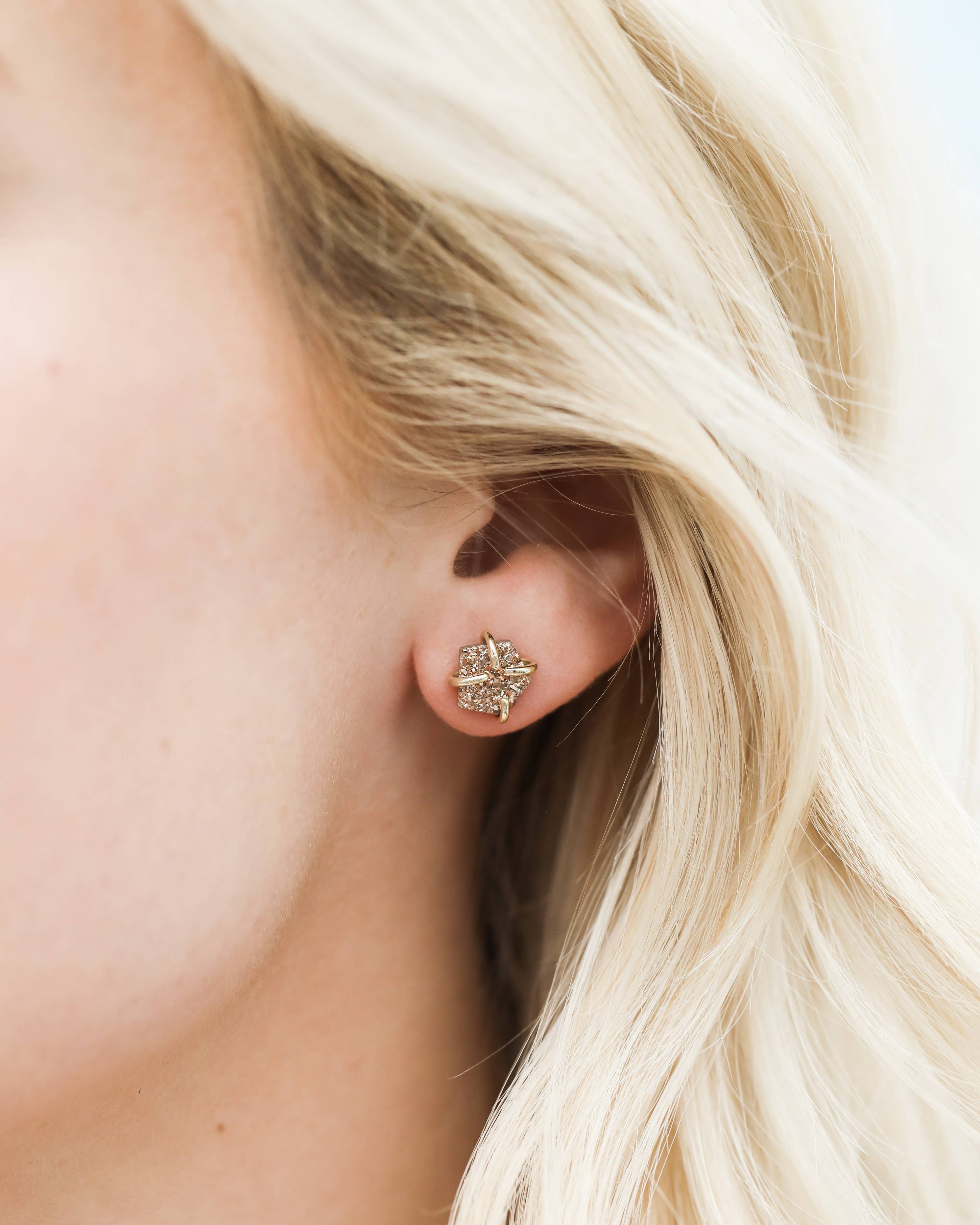 Close-up of a person wearing a diamond Rose Gold Druzy Prong Gold Earrings