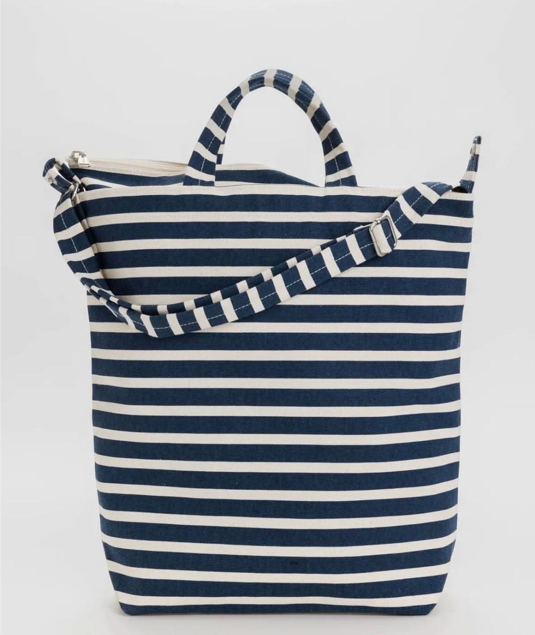 Blue and white horizontally striped duck bag from BAGGU sitting against white background