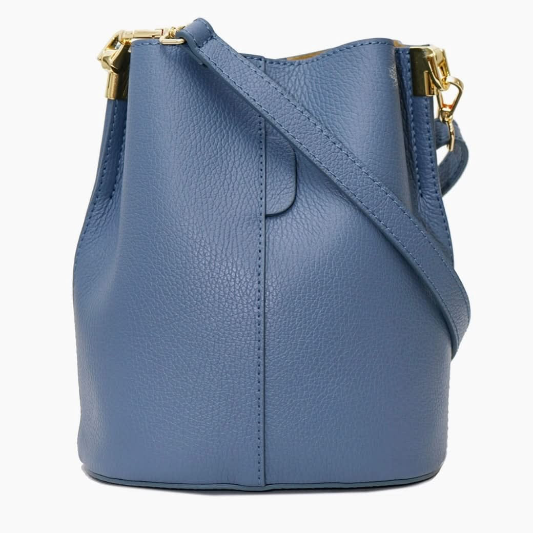 Blue leather handbag with gold hardware on a white background