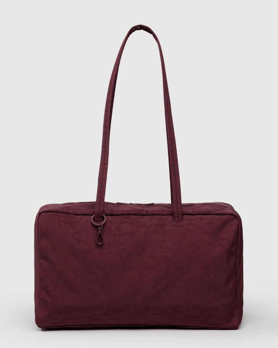 Maroon BAGGU bowler bag with a handle on a white background