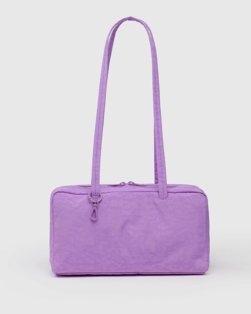 Purple lilac handbag with a long strap on a white background