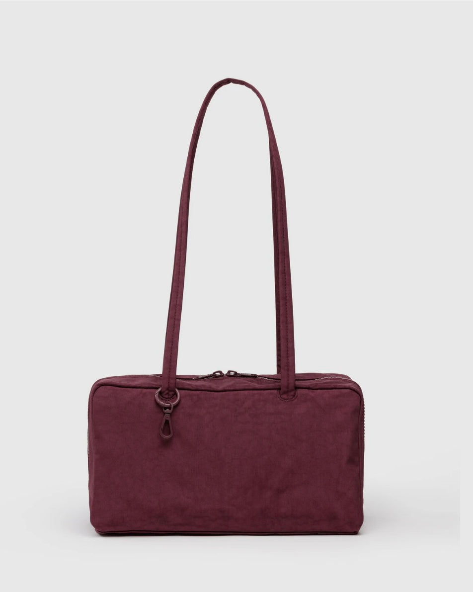 Maroon BAGGU bowler bag with a strap on a white background