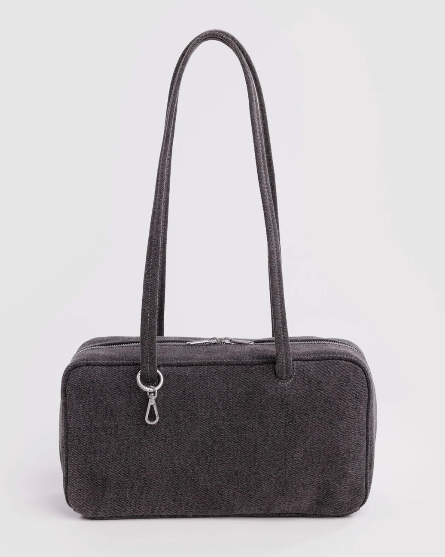 A dark gray textured fabric travel or toiletry bag with two shoulder straps and a silver zipper closure, shown against a plain light gray background.