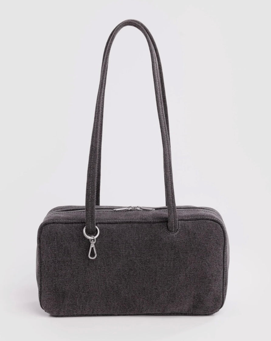 A dark gray textured fabric travel or toiletry bag with two shoulder straps and a silver zipper closure, shown against a plain light gray background.