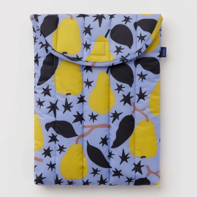 A quilted fabric pouch featuring a pattern of yellow pears, black leaves, and black stars on a light blue background, shown against a plain white studio backdrop.