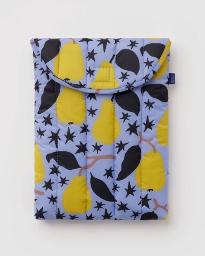 A quilted fabric pouch featuring a pattern of yellow pears, black leaves, and black stars on a light blue background, shown against a plain white studio backdrop.