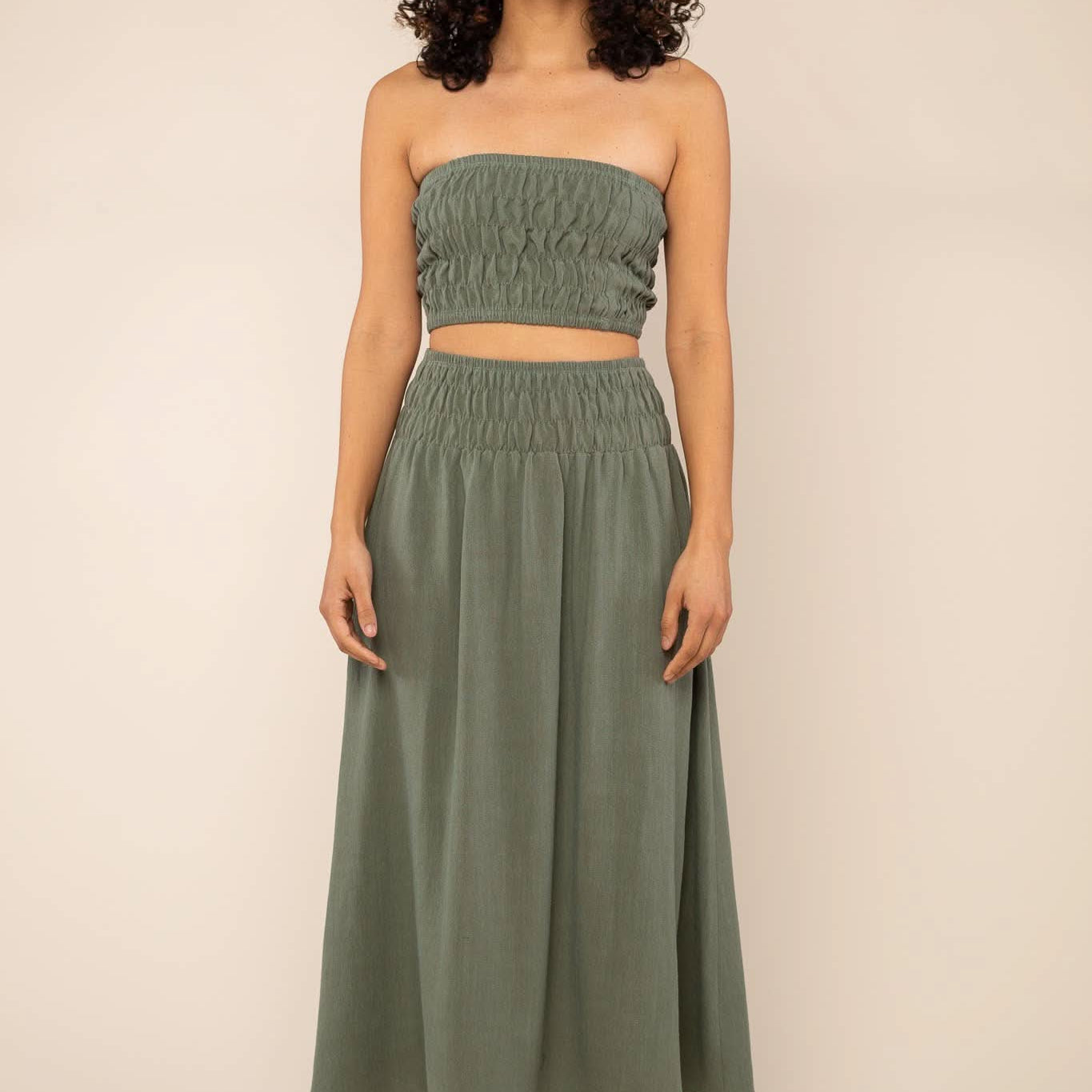 Sophia Linen Skirt Woman modeling a two-piece sage green linen co-ord set