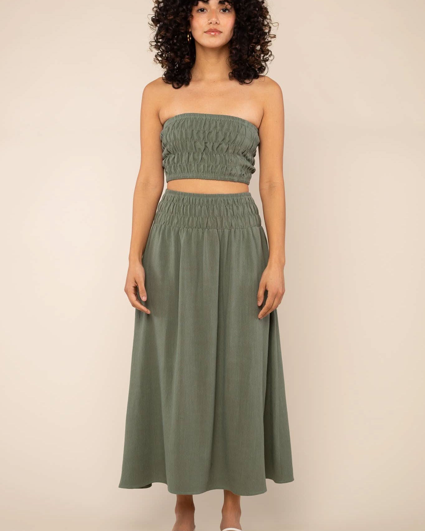 Sophia Linen Skirt Woman modeling a two-piece sage green linen co-ord set