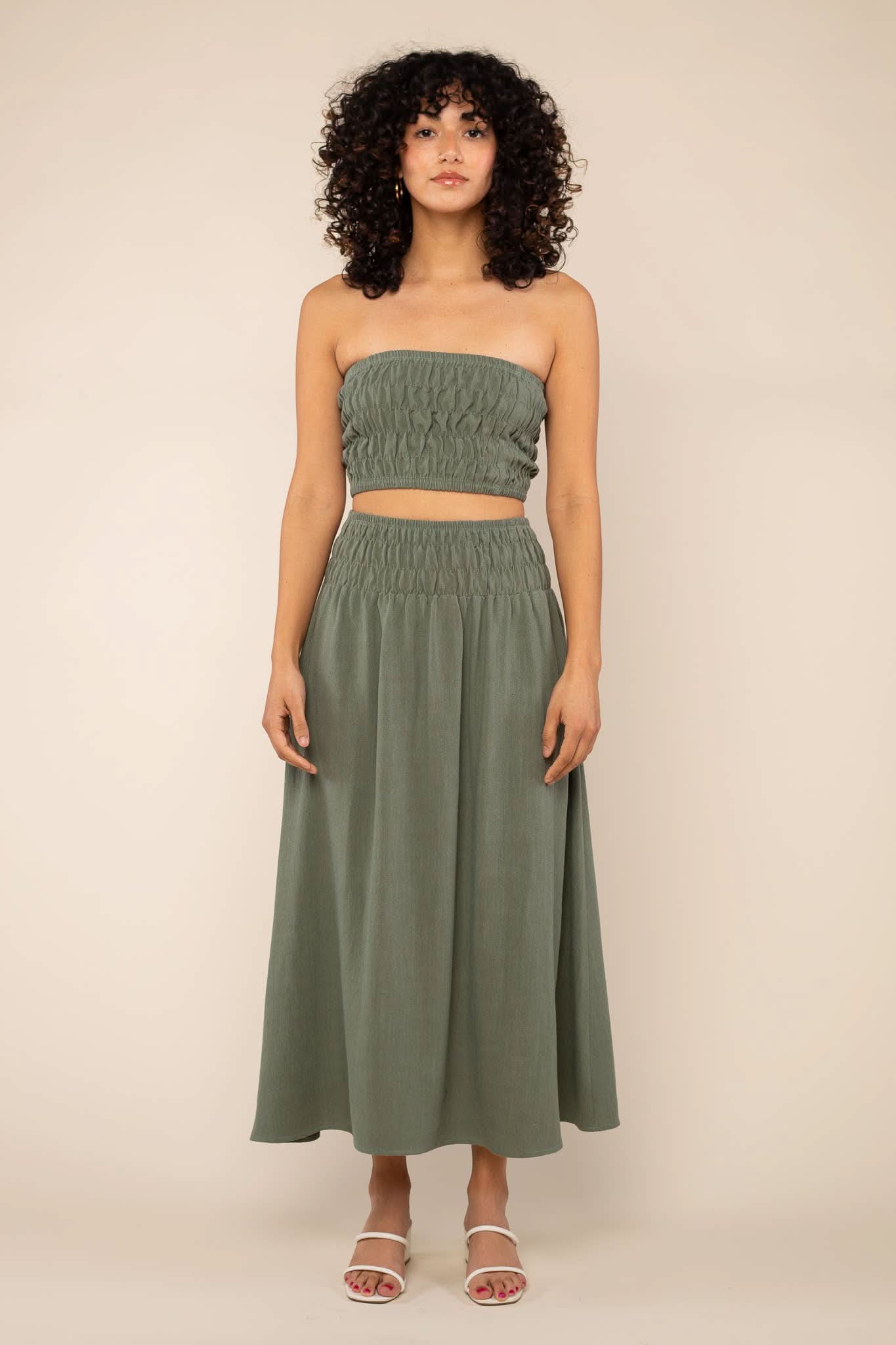 Sophia Linen Skirt Woman modeling a two-piece sage green linen co-ord set