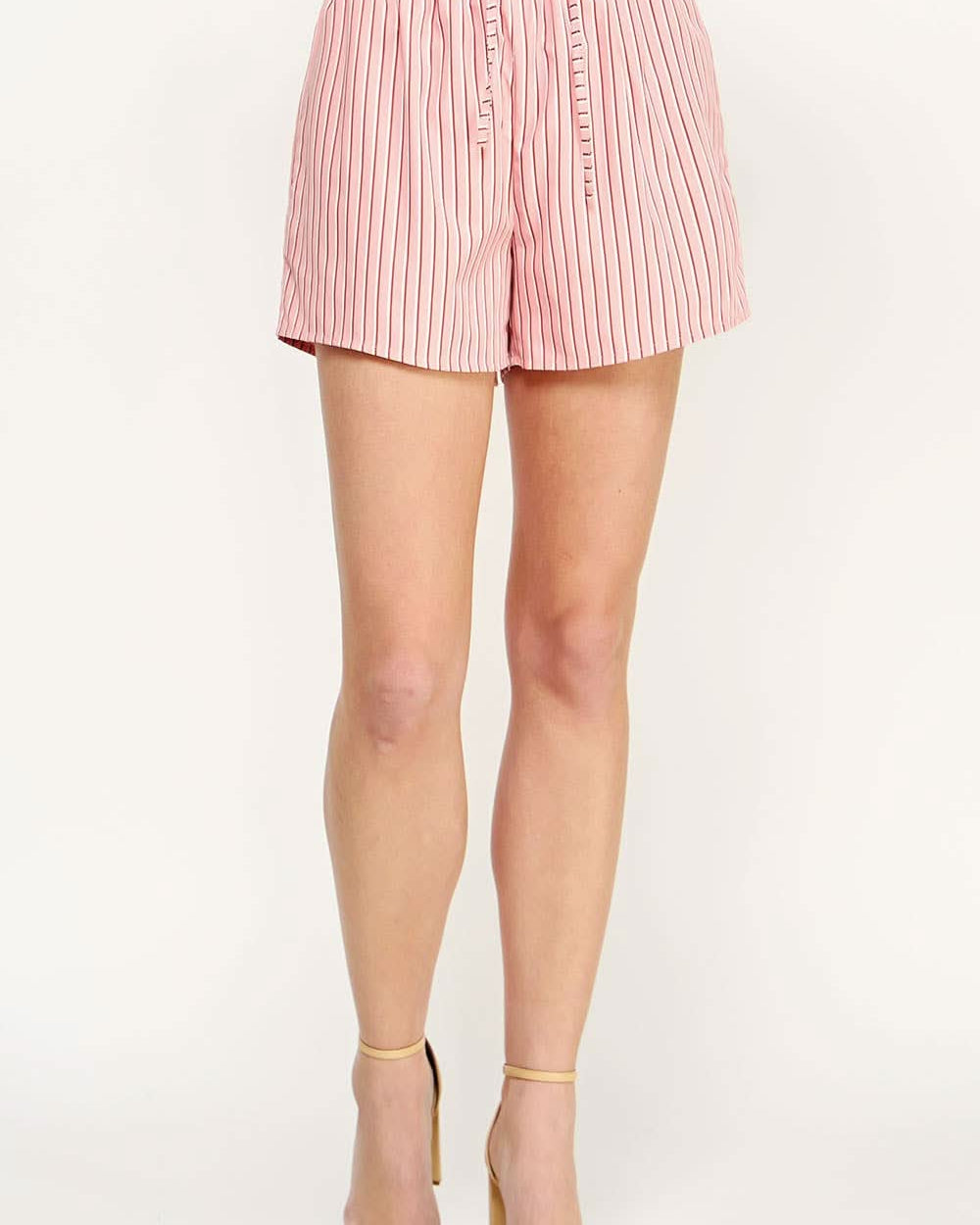 Woman wearing pink and white shorts