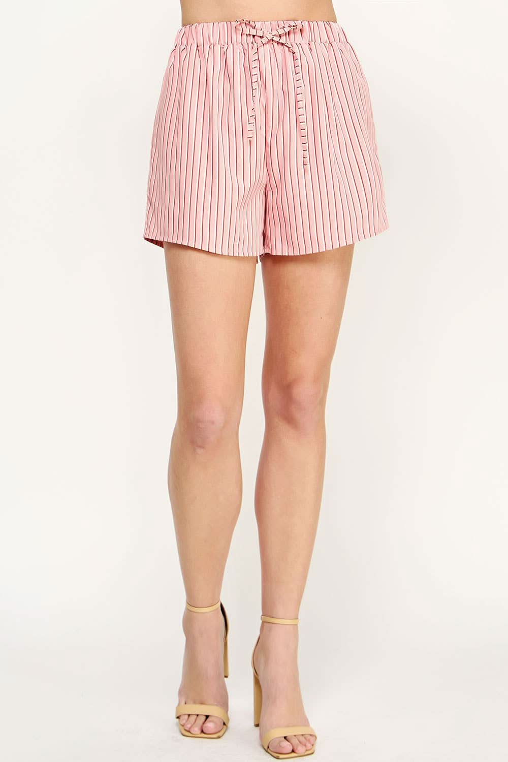 Woman wearing pink and white shorts