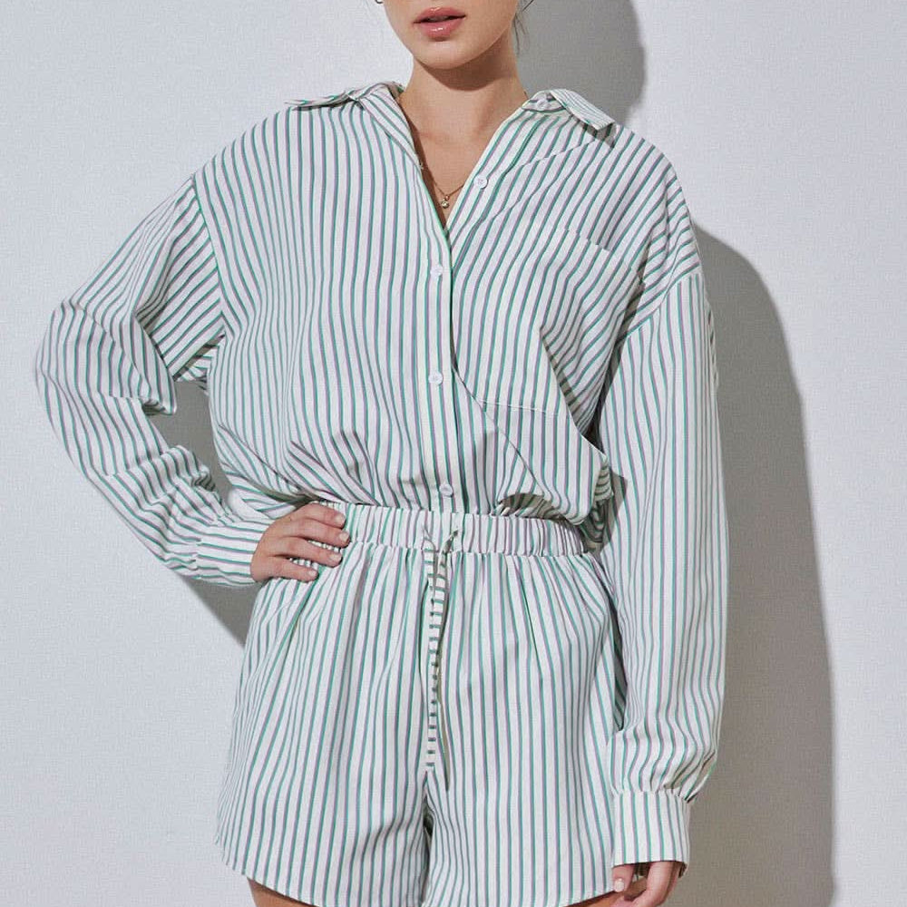 Woman wearing vertically striped green purple and blue set