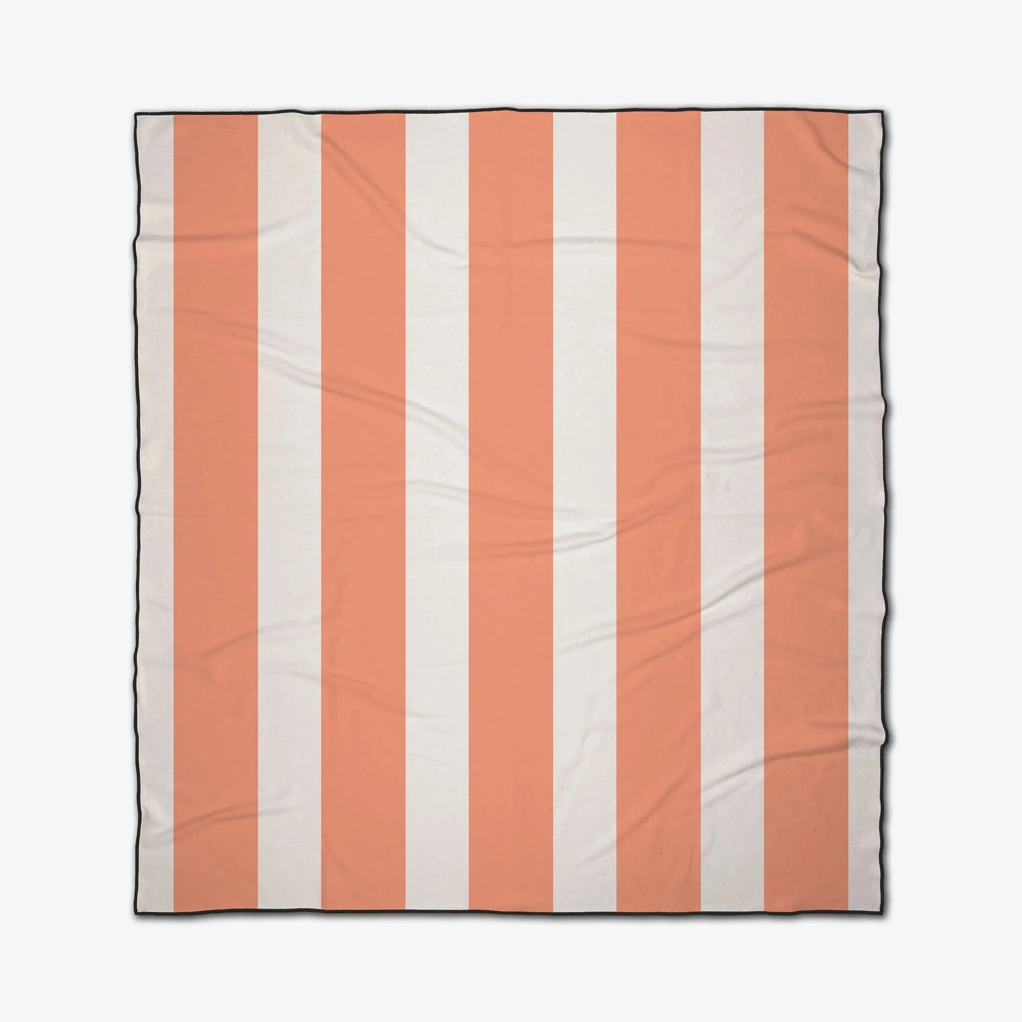 Striped blanket with orange and white vertical stripes on a white background
