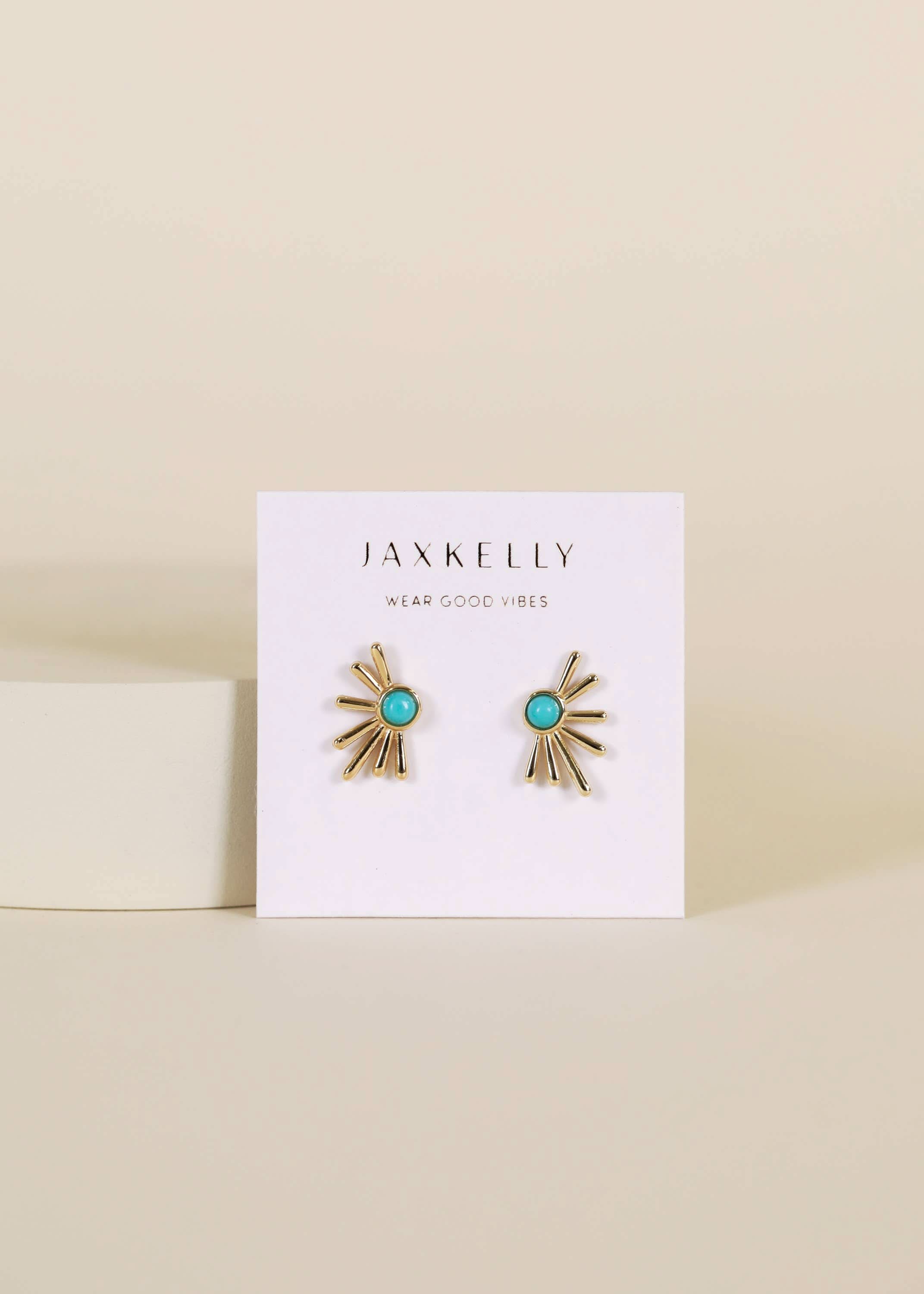 Pair of gold and turquoise earrings on a Jaxkelly branded card