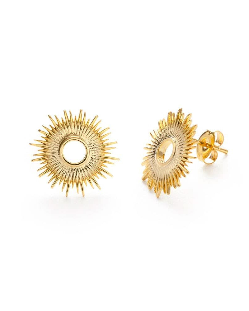 Gold stud earrings in a circle sunburst pattern pair