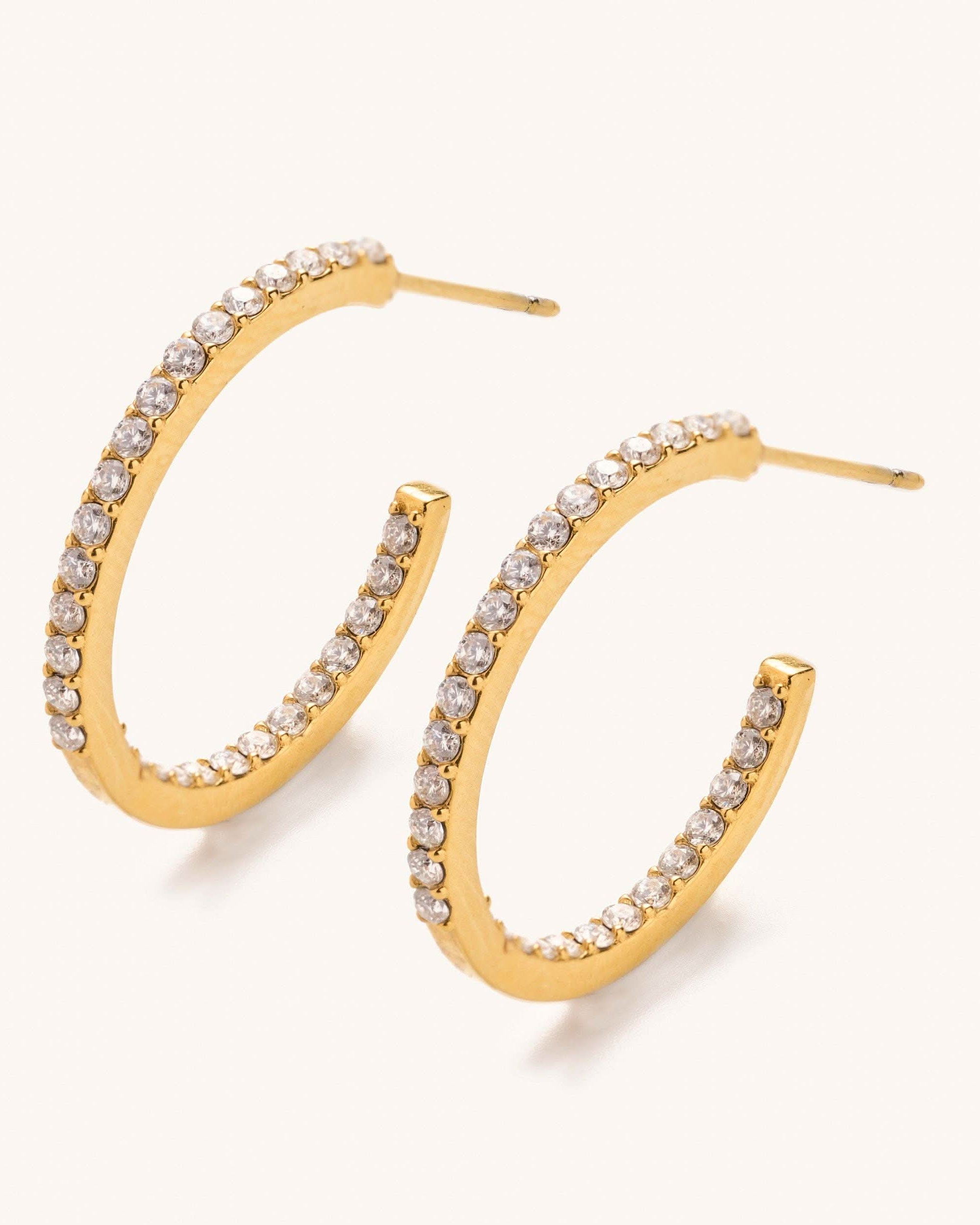 Sutton Crystal Hoops-Small earrings with clear gemstones on a white background