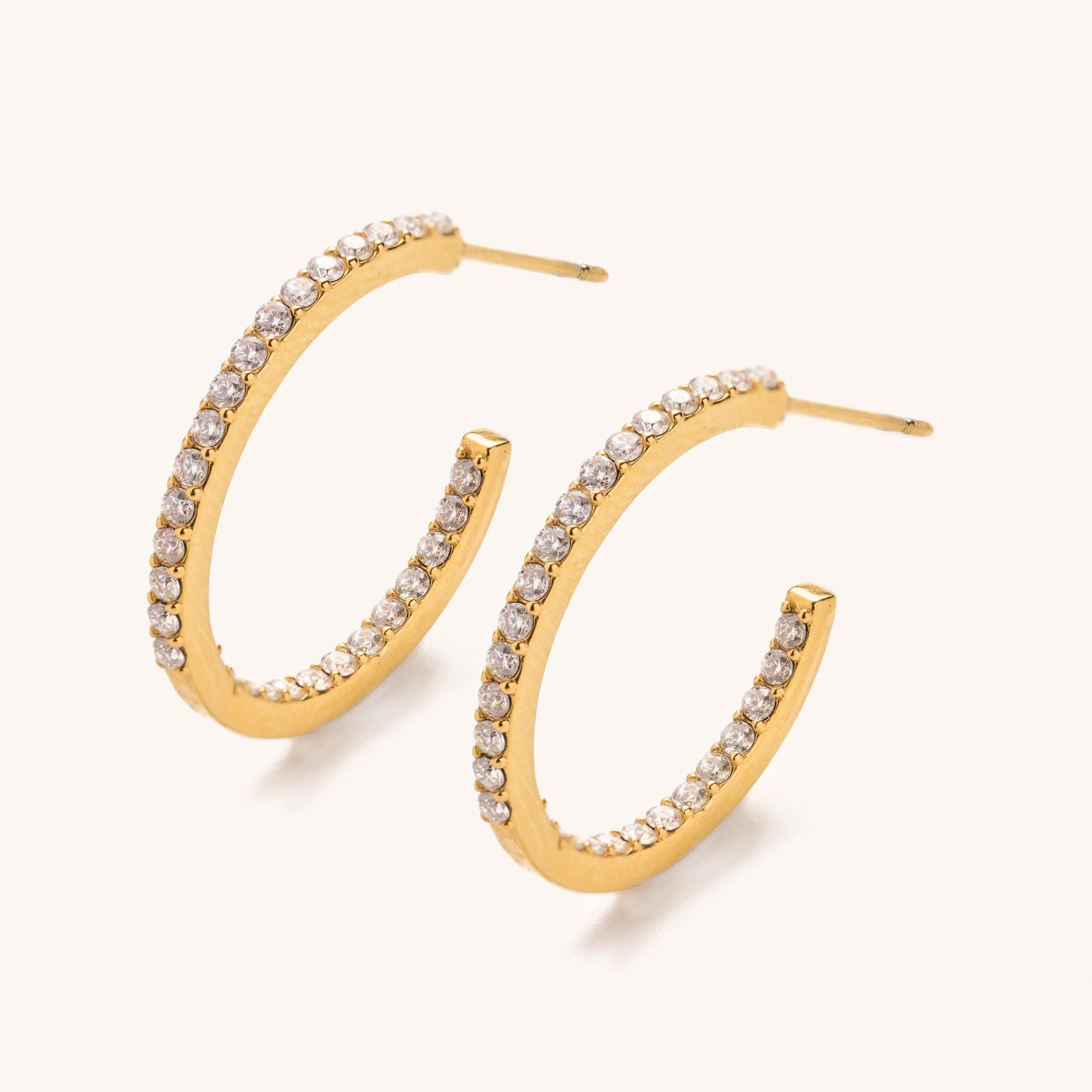 Sutton Crystal Hoops-Small earrings with clear gemstones on a white background