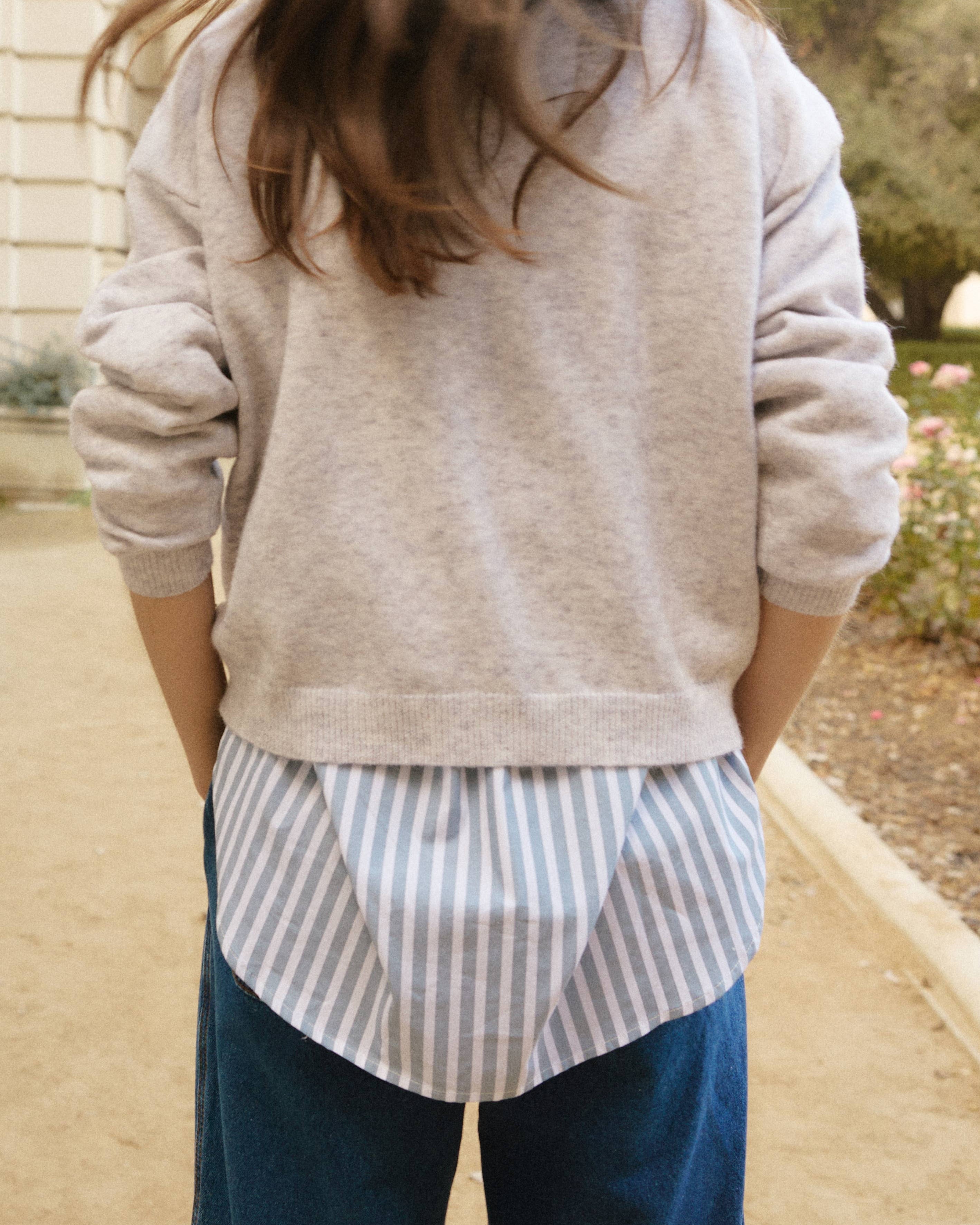 This comfortable, multi-colored knit sweater is designed with a relaxed fit