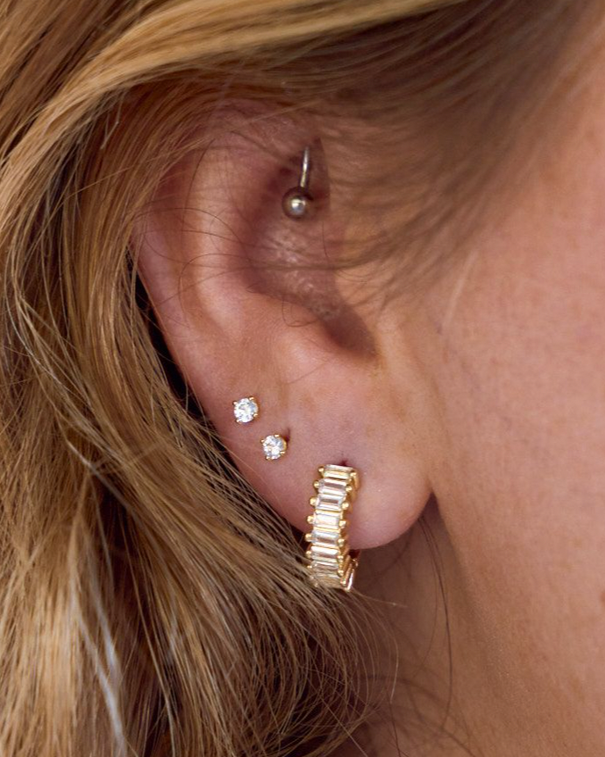 Woman wearing Medium sized waterproof gold CZ hoop earrings