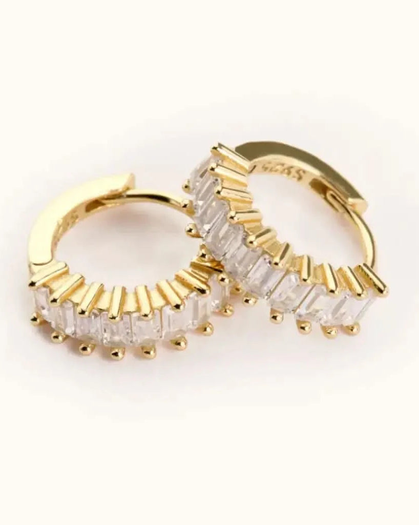 Medium sized waterproof gold CZ hoop earrings on white background
