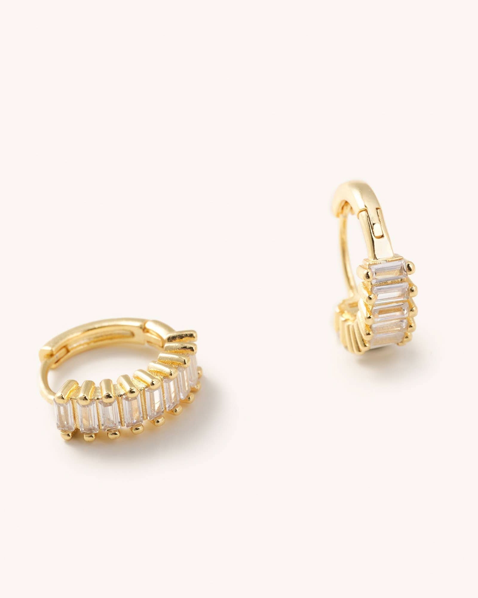Medium sized waterproof gold CZ hoop earrings laying