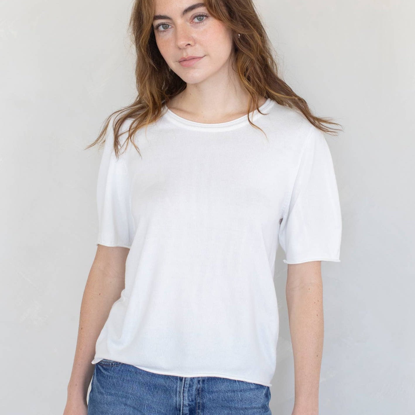 model wearing white t-shirt sweater