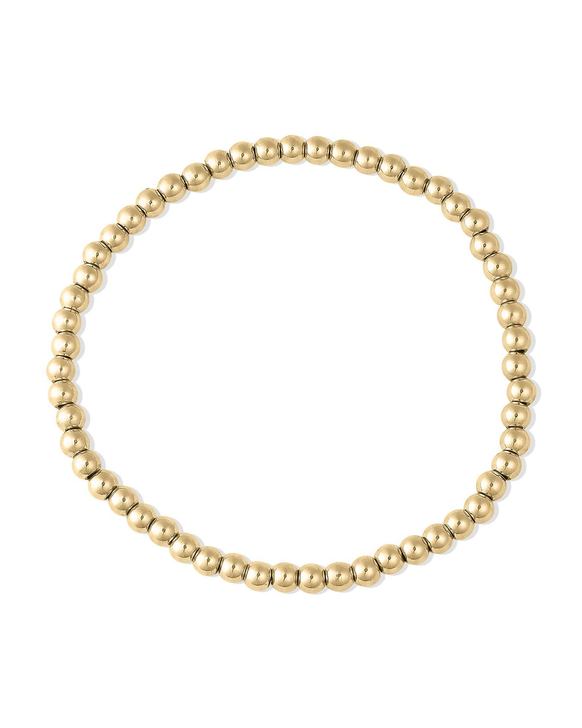 Gold beaded bracelet on a black background
