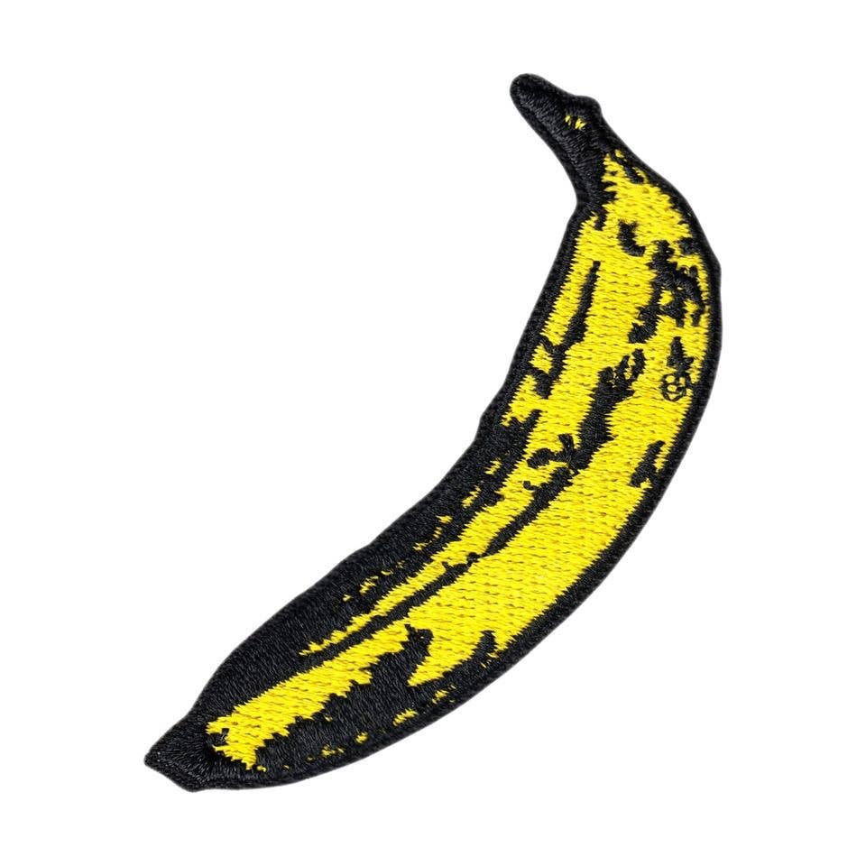 Yellow banana with black outline on a white background