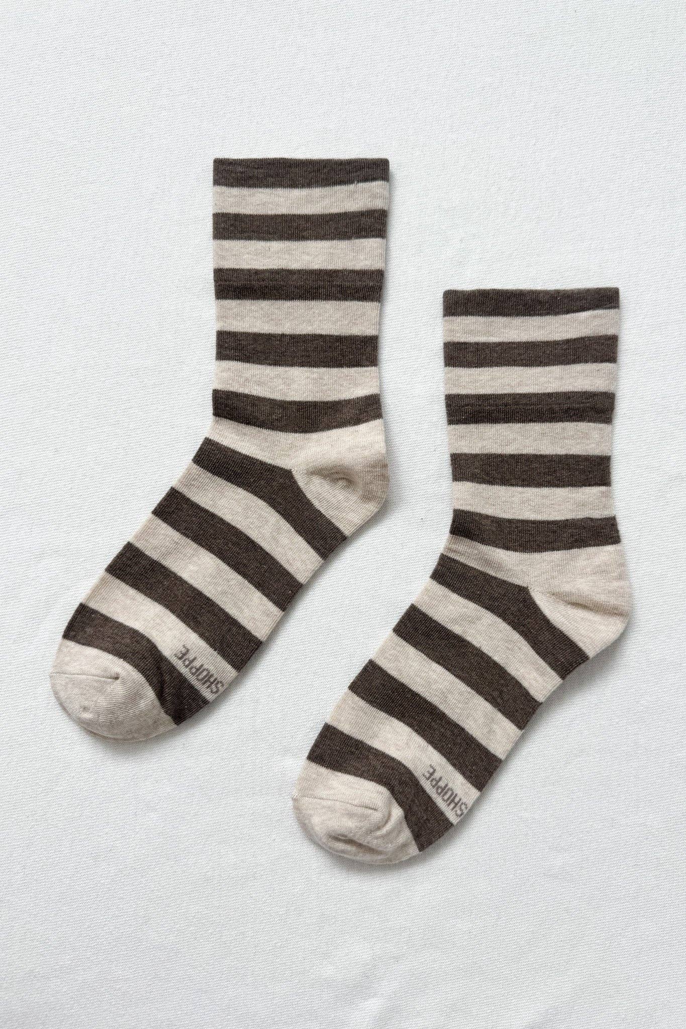 Pair of striped socks on a light gray background